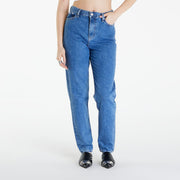 Person wearing blue jeans on a white background